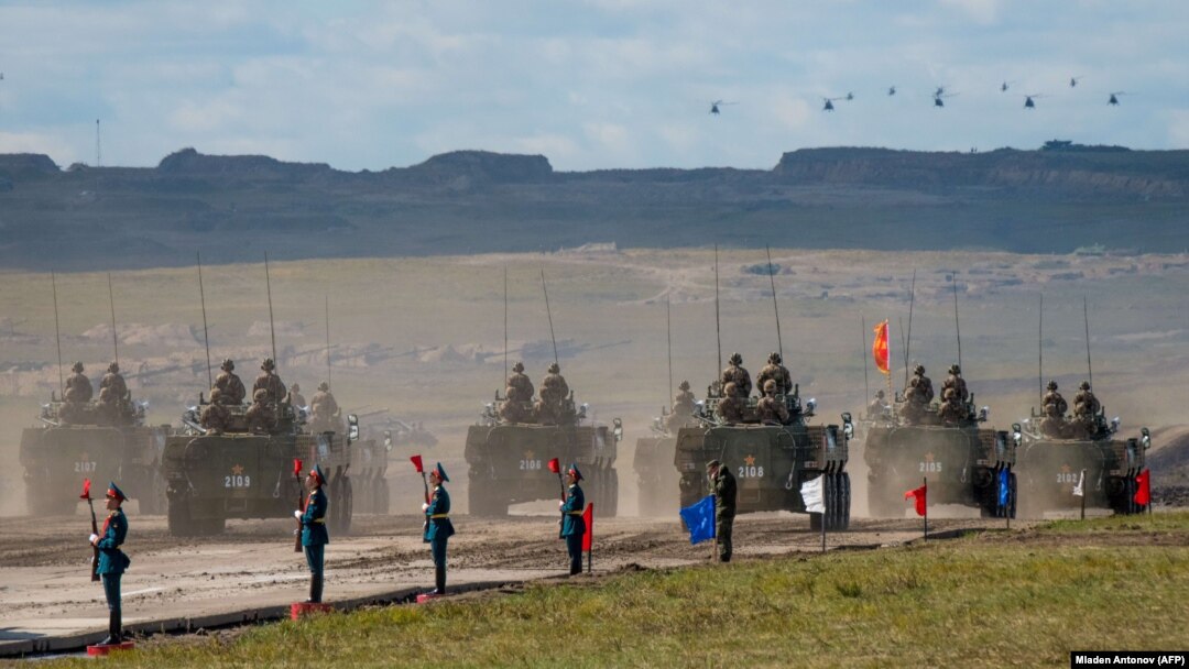 Russian, Chinese, and Mongolian troops and military equipment parade at the end of the day of the Vostok-2018 military drills not far from the Chinese-Mongolian border in Siberia in September 2018.
