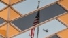 The U.S. flag and a helicopter are reflected in the windows of the U.S. Embassy in Kabul. (file photo)