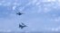 A Russian Air Force Su-27 fighter jet (bottom) maneuvers near a NATO F-18 warplane over the Baltic Sea on August 13.
