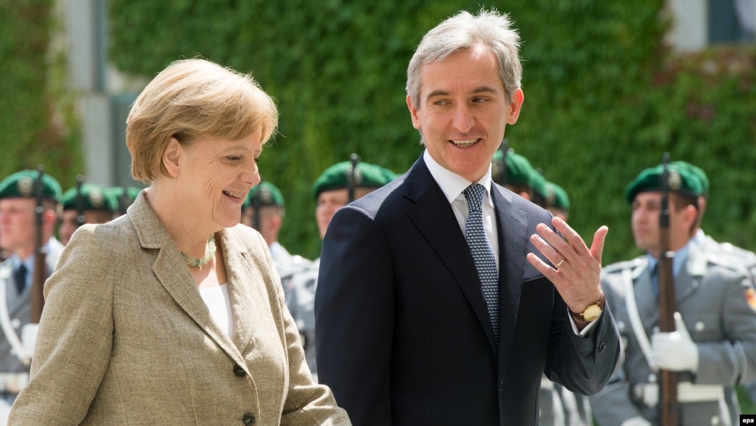 German Chancellor Angela Merkel (left) walks with Moldovan Prime Minister Iurie Leanca during a welcoming ceremony in Berlin on July 10.