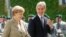 German Chancellor Angela Merkel (left) walks with Moldovan Prime Minister Iurie Leanca during a welcoming ceremony in Berlin on July 10.