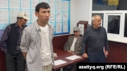 Kazakh activist Abzal Dostiyarov at Almaty's Auezov District Prosecutor's Office earlier this month. 