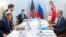 U.S. Secretary of State John Kerry (front left) and Russian Foreign Minister Sergei Lavrov (front right) sit down for bilateral talks focused on the Syrian crisis in Geneva on August 26.