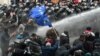 GEORGIA -- Police fires a water cannon against protesters demanding the government's resignation and early parliamentary polls outside the parliament in Tbilisi, November 18, 2019