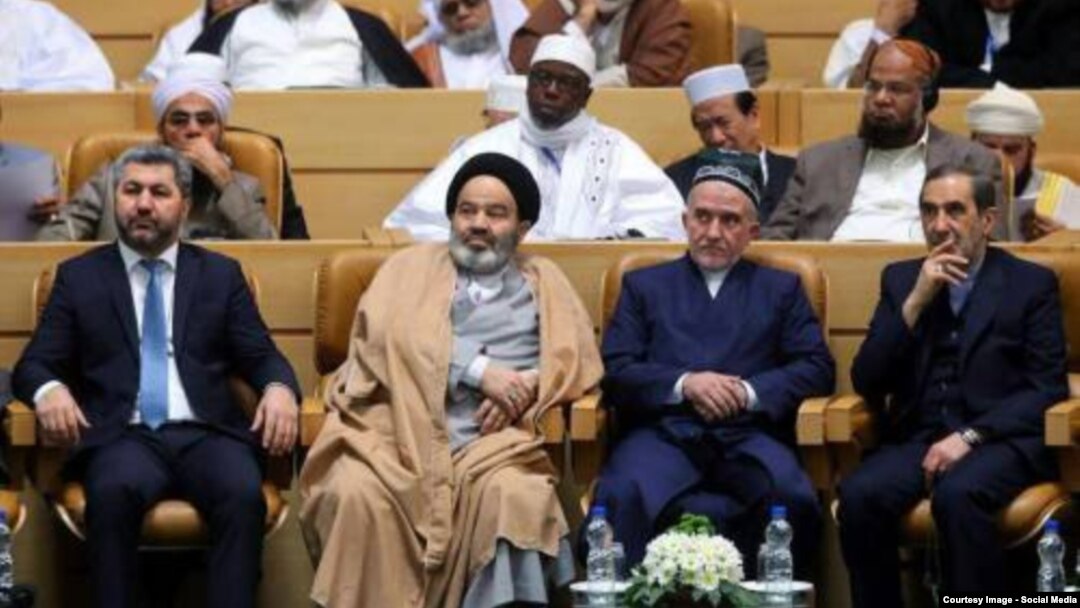 Muhiddin Kabiri (left) pictured with other conference delegates in Tehran on December 28. 