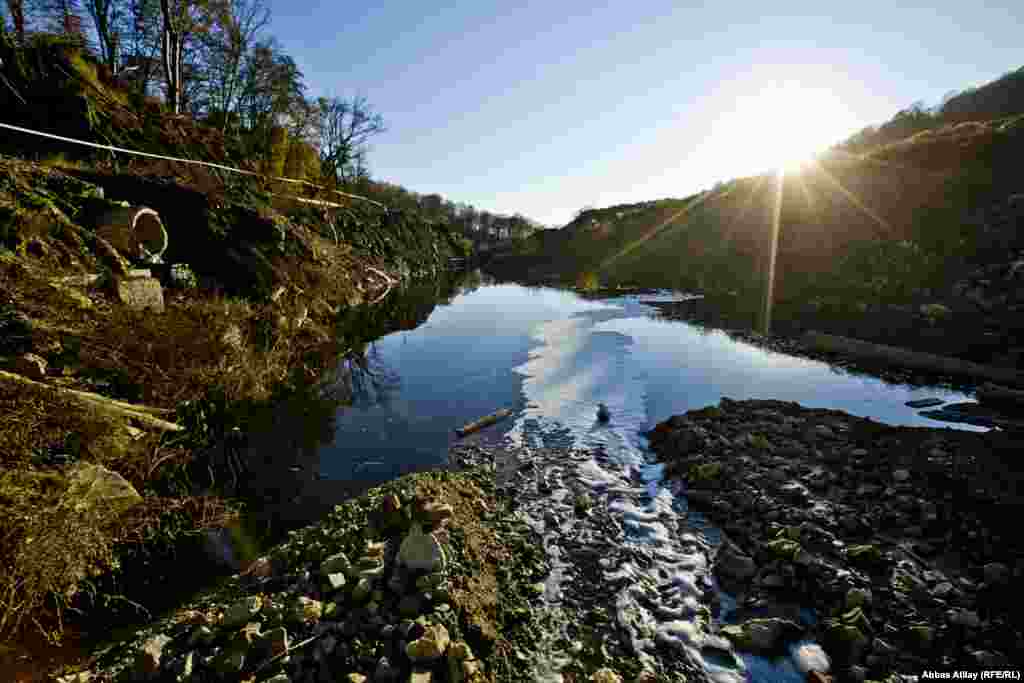 The Bytkh river flows through the fringes of the rubbish dump near the village of Uch-Dere. The landfill has been here since the Soviet era. 