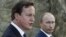 British Prime Minister David Cameron (left) and Russian President Vladimir Putin speak to the media in Sochi.