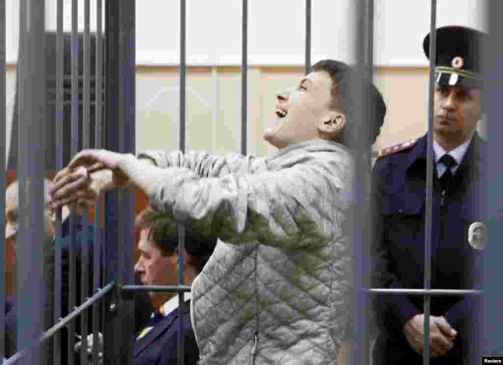 Jailed Ukrainian military pilot Nadezhda Savchenko reacts inside a defendants&#39; cage as she attends a court hearing in Moscow on May 6. (Reuters/Sergei Karpukhin)