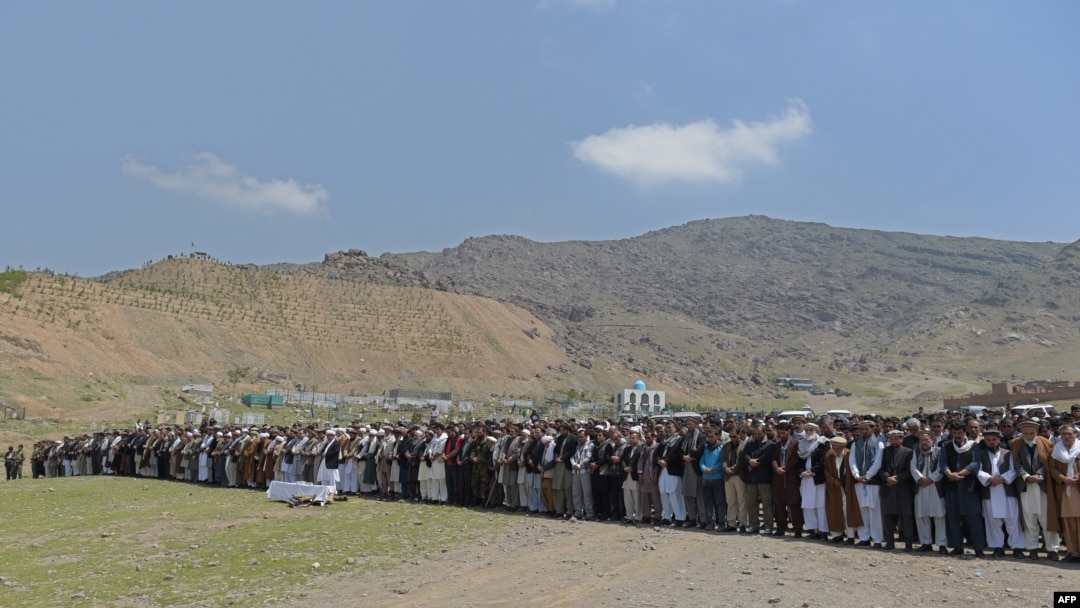 Afghan mourners offer funeral prayers for a victim killed in a Taliban truck-bomb attack in April. New figures indicating that rates of civilian casualties in the restive country may be leveling off at near-record levels after steadily increasing over the previous years.