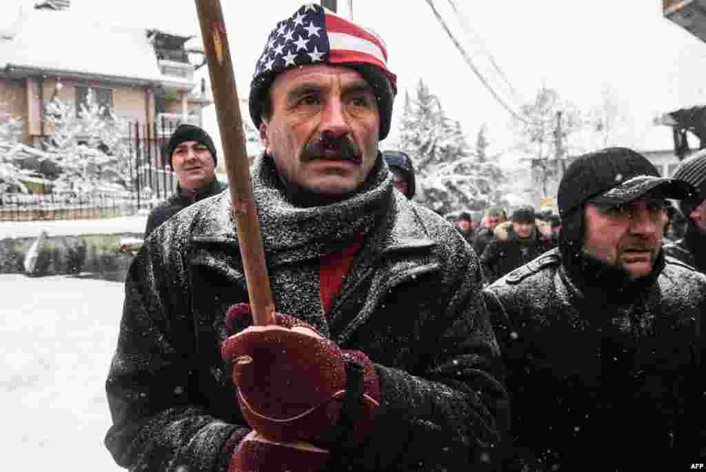 Ethnic Albanians take part in a protest in Pristina on January 6 in response to an international arrest warrant for a former prime minister on war crimes filed by Serbia. (AFP/Armend Nimani)