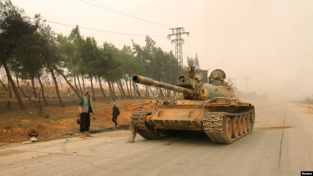 A tank of the rebels drives in Dahiyat al-Assad, the western part of Aleppo, on October 28.