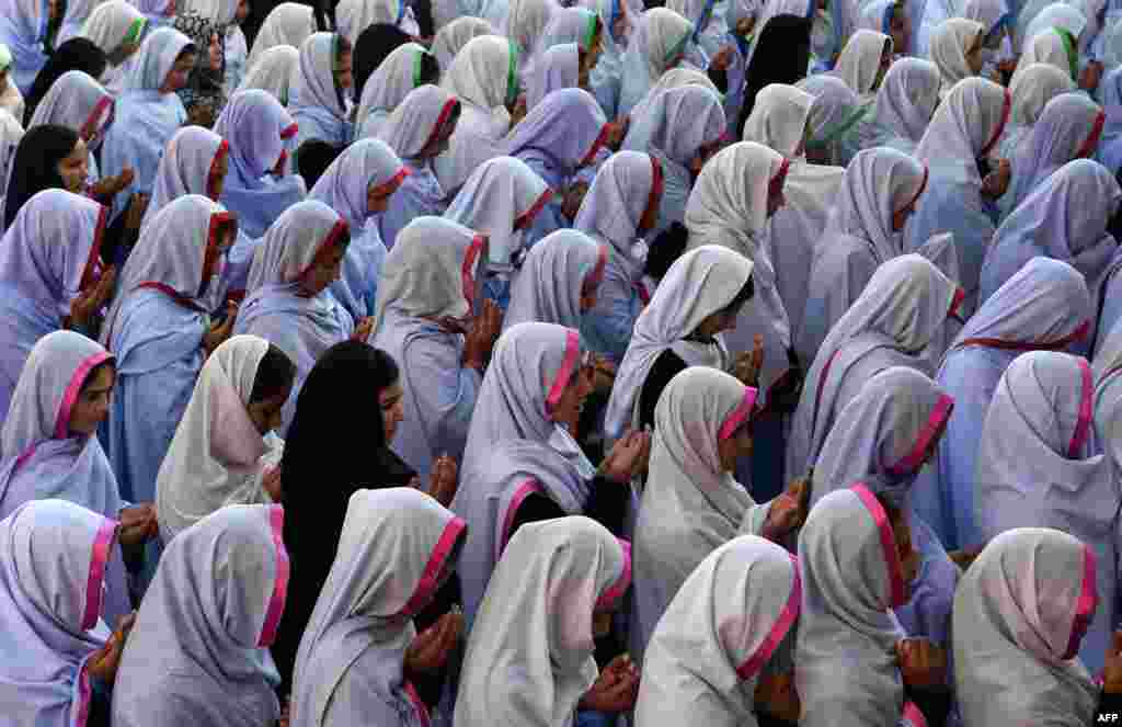 Pakistani schoolgirls offer prayers for Nobel Peace Prize laureate Malala Yousafzai during a school assembly in Mingora in the Swat Valley. (AFP/A. Majeed)