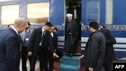 Iranian President Hassan Rohani (C) at the Ak Yayla train station on the Turkmenistan border, December 2014.