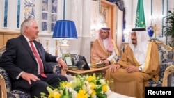 Saudi Arabia's King Salman bin Abdulaziz al-Saud (right) meets with U.S. Secretary of State Rex Tillerson in Jeddah on July 12.