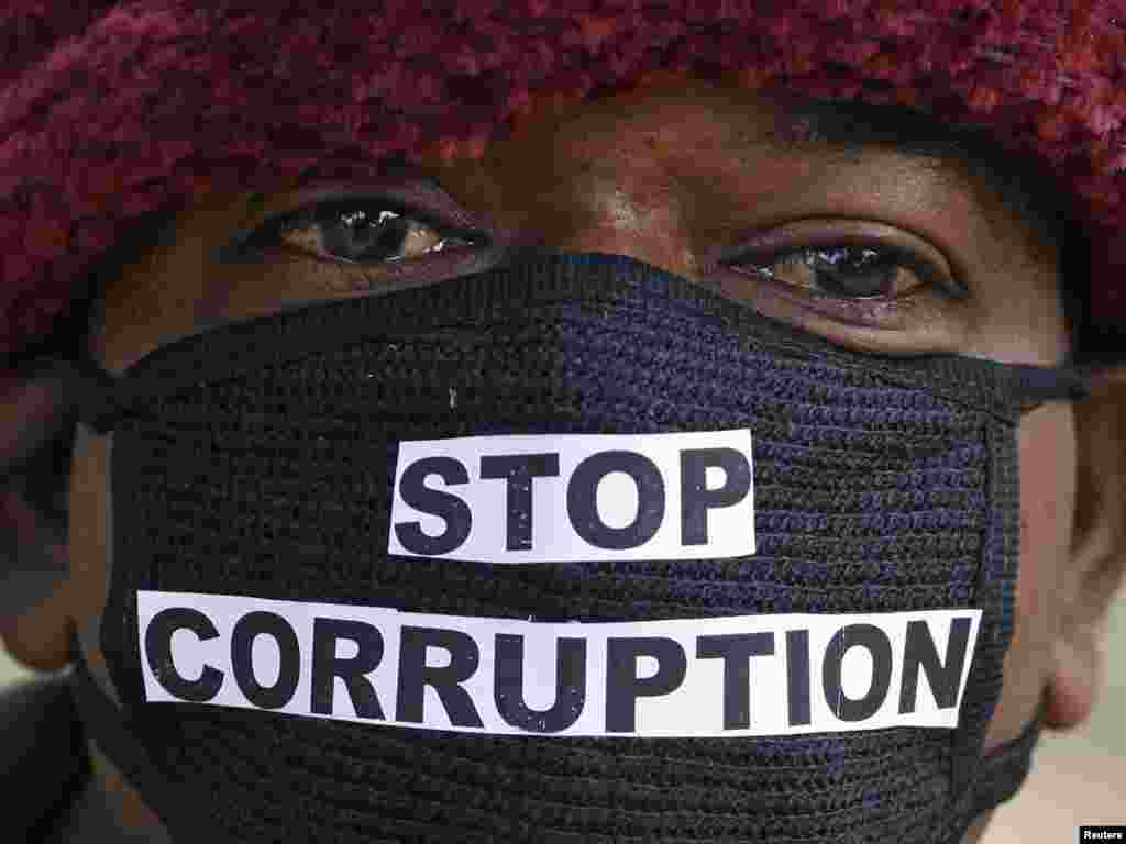 An Indian telecom employee takes part in a silent protest against a corruption scandal on December 9. Photo by Parivartan Sharma for Reuters