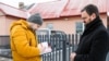 Belarus - RFE/RL journalist Dzmitry Hurnievic donates his books after his presentation was foiled, 08.02.20