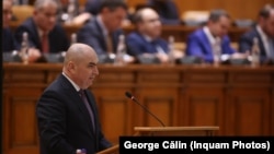 Premierul român Ilie Bolojan la o ședință a Parlamentului României, din 19 martie, pentru dezbaterea legilor bugetare pe 2026,