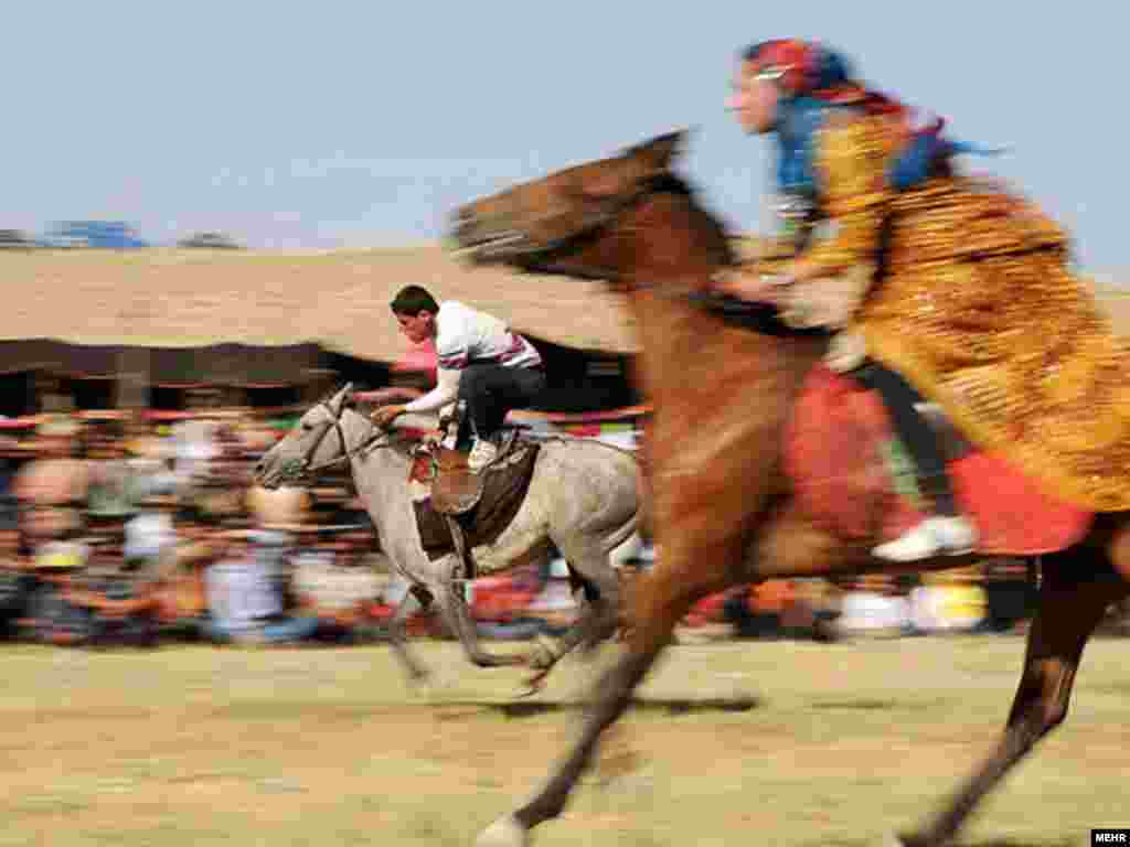 Nomads race on horseback during a cultural festival in Semirom, southern Iran. Photo by Mehr 