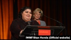 RFE/RL's Azerbaijani Service correspondent Khadija Ismayilova accepts the 2012 "Courage in Journalism" award from the International Women's Media Foundation in New York in October 2012.