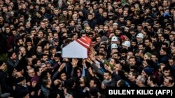 People carry the coffin of Yunus Gormek, 23, one of the victims of the Reina nightclub attack, during his funeral in Istanbul on January 2.