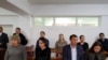 Three of the activists (back row, left to right) Anuar Ashiraliev, Oksana Shevchuk, and Gulzipa Zhaukerova in court on November 19. 