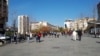 Kosovo: People walking in the mains square in Pristina