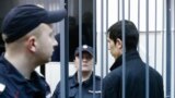 Petersburg, stands inside the defendant's cage as he attends a court hearing in Moscow, Russia, April 18, 2017