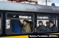 Passengers on a tram in Dnipro on December 13.