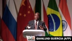 South African President Cyril Ramaphosa addresses delegates at a business forum during the 10th BRICS summit on July 25.