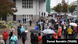 People gather outside the Central Post Office after being evacuated due to an anonymous bomb threat call in Yekaterinburg in September.