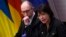 Ukrainian Prime Minister Arseniy Yatsenyuk (left) and Finance Minister Natalie Jaresko are in Washington this week to meet with the International Monetary Fund (IMF), promote Ukraine as an investment destination, and ask U.S. officials for more economic and military support.