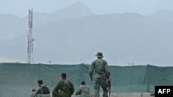 Security forces taking positions during clashes with Taliban fighters near the National Consultive Peace Jirga in Kabul on June 2.