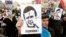 Protesters hold portraits of Ukrainian President Viktor Yanukovych during a demonstration in support of EU integration on Independence Square in Kyiv on November 29.