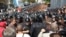 Police scuffled with angry lawmakers and protesters who oppose the Russian language bill outside the Kyiv building where President Viktor Yanukovych planned to discuss the recent Euro 2012 football championships.
