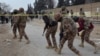 Pakistani paramilitary troops enter a cordoned site after gunmen shot dead four fellow soldiers in Quetta in February.