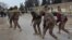 Pakistani paramilitary troops enter a cordoned site after gunmen shot dead four fellow soldiers in Quetta in February.