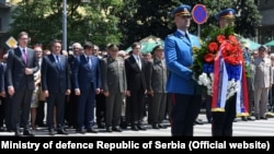 Serbian President Aleksandar Vucic (far left) leads official St. Vitus's Day commemorations in Belgrade on June 28. 