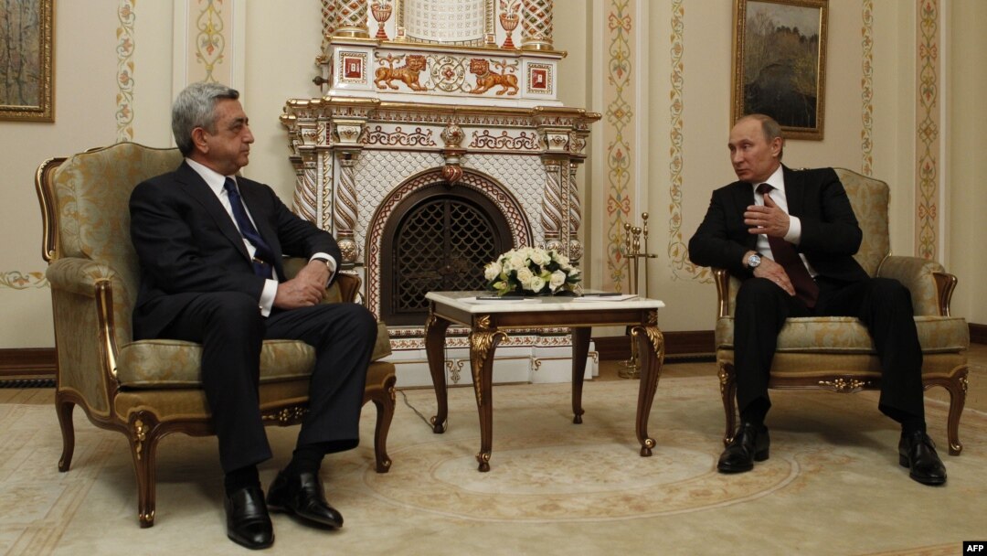 Russian President Vladimir Putin (right) speaks with his Armenian counterpart, Serzh Sarkisian, outside Moscow in March.