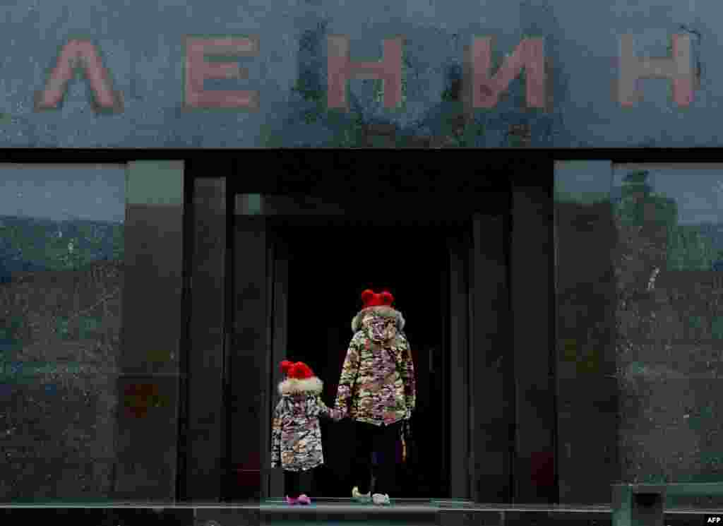 Children enter Lenin's mausoleum while visiting Red Square in Moscow. (AFP/Natalia Kolesnikova)