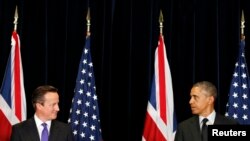 Președintele Barack Obama și premierul britanic David Cameron la conferința de presă comună de la Bruxelles