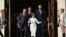 Moldova's President Maia Sandu leads Polish Prime Minister Donald Tusk (L), French President Emmanuel Macron, and German Chancellor Friedrich Merz (R) down the stairs following a press conference as they celebrate the country's 34th independence day and a