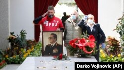 Supporters of Josip Broz Tito lay flowers on his tomb during a ceremony marking the 40th anniversary of his death in Belgrade on May 4.