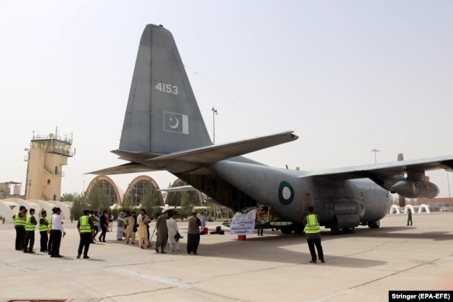 Packages of food and medical supplies donated by Pakistan to Afghanistan are unloaded at an airport in Kandahar in September.