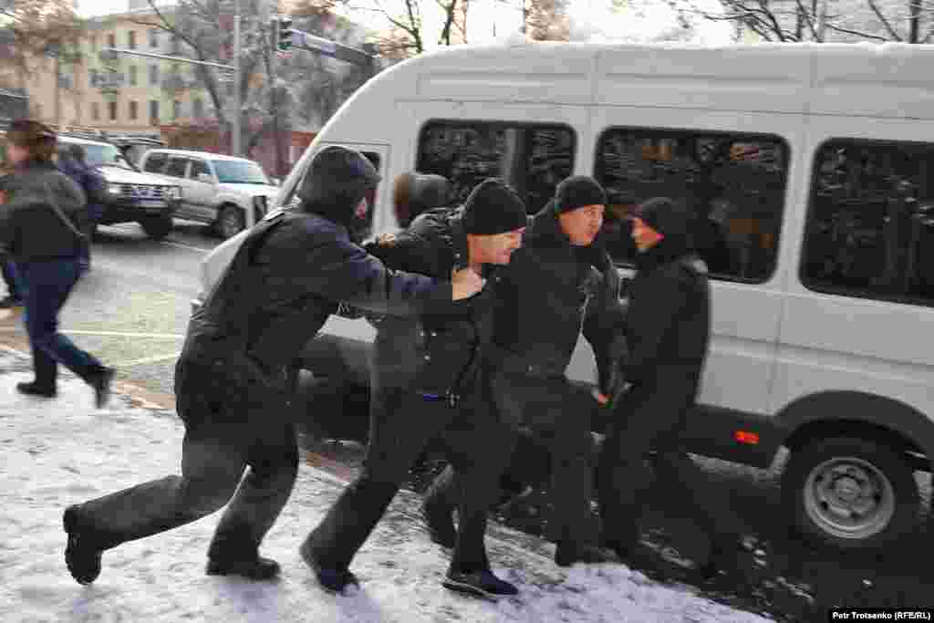 A man being arrested in Almaty.&nbsp;