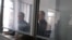 Uali Aliasqarov (left) and Mikhail Tkachyov in court in Qaraghandy on November 21. 