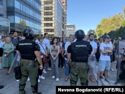 Police cordons face off with protesters in Belgrade on September 20.