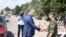 Moldovan President Igor Dodon (left) shakes hands with a Russian soldier at the peacekeeping post in Varniţa.