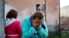 A woman reacts to damage caused to a building following a missile attack at an undisclosed location in the Odesa region in November. (file photo)