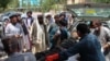 A victim, injured in an explosion at a cattle market in Sangin district, is brought to a hospital in Lashkar Gah city of Helmand Province on June 29.