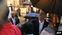 U.S. President Barack Obama talks to tourists and Cubans upon arriving at Havana Cathedral on March 20, when Obama became the first U.S. leader to visit Cuba in 88 years. 